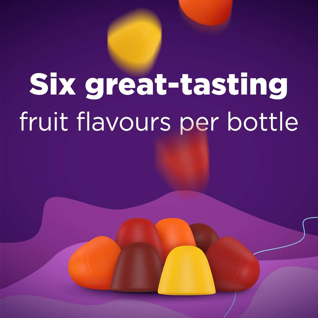 Colorful fruit-shaped fibre gummies on a purple background with text about fruit flavors.