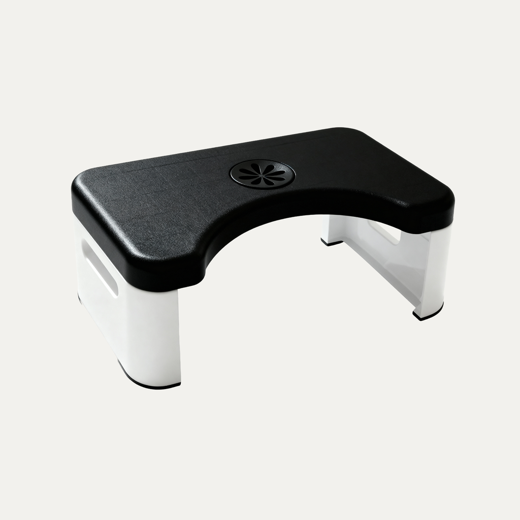 Toilet stool with black top and white base on a light gray background