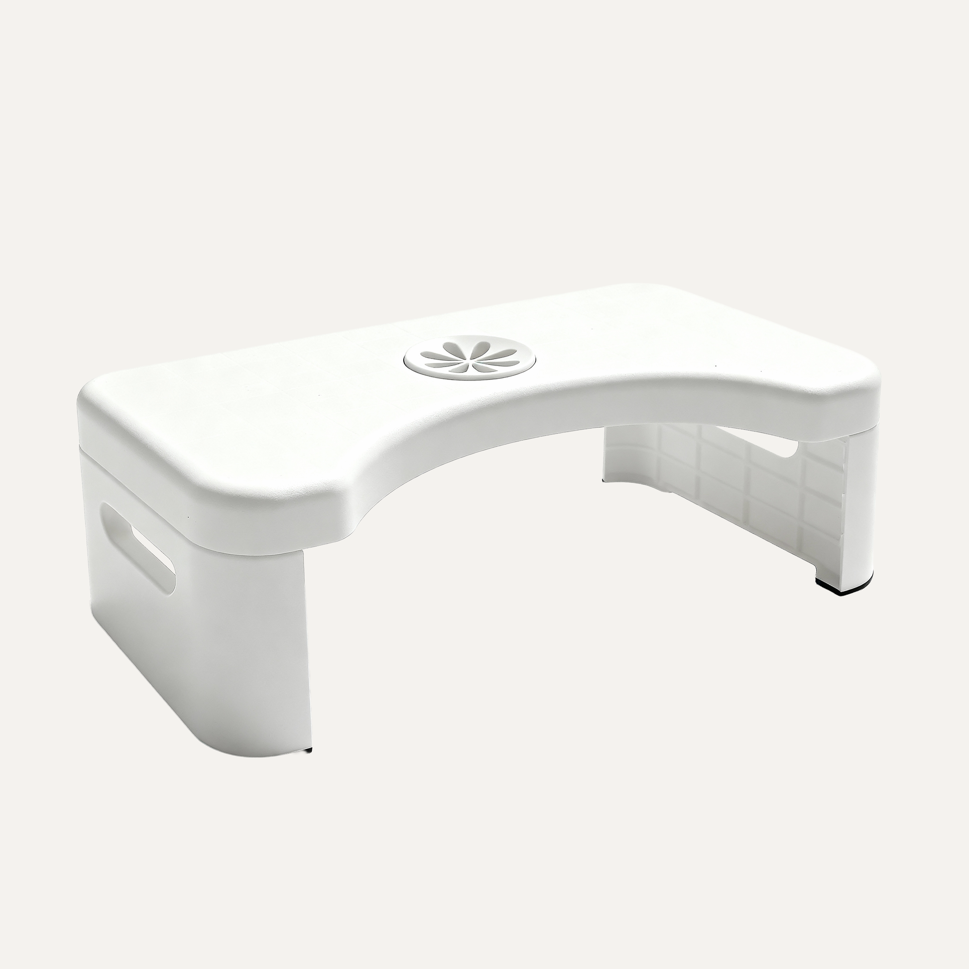 White curved toilet stool from squatbuddy on a white background