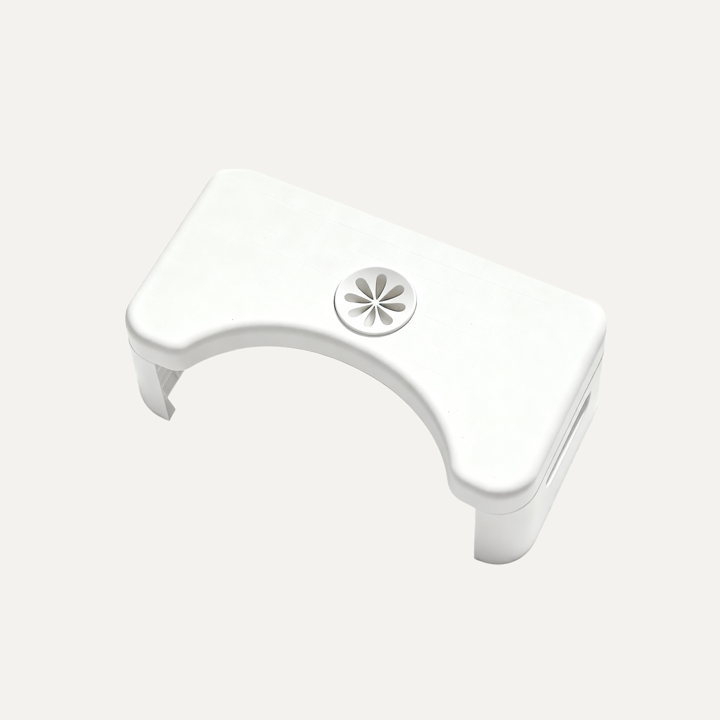 White toilet footstool on a light gray background