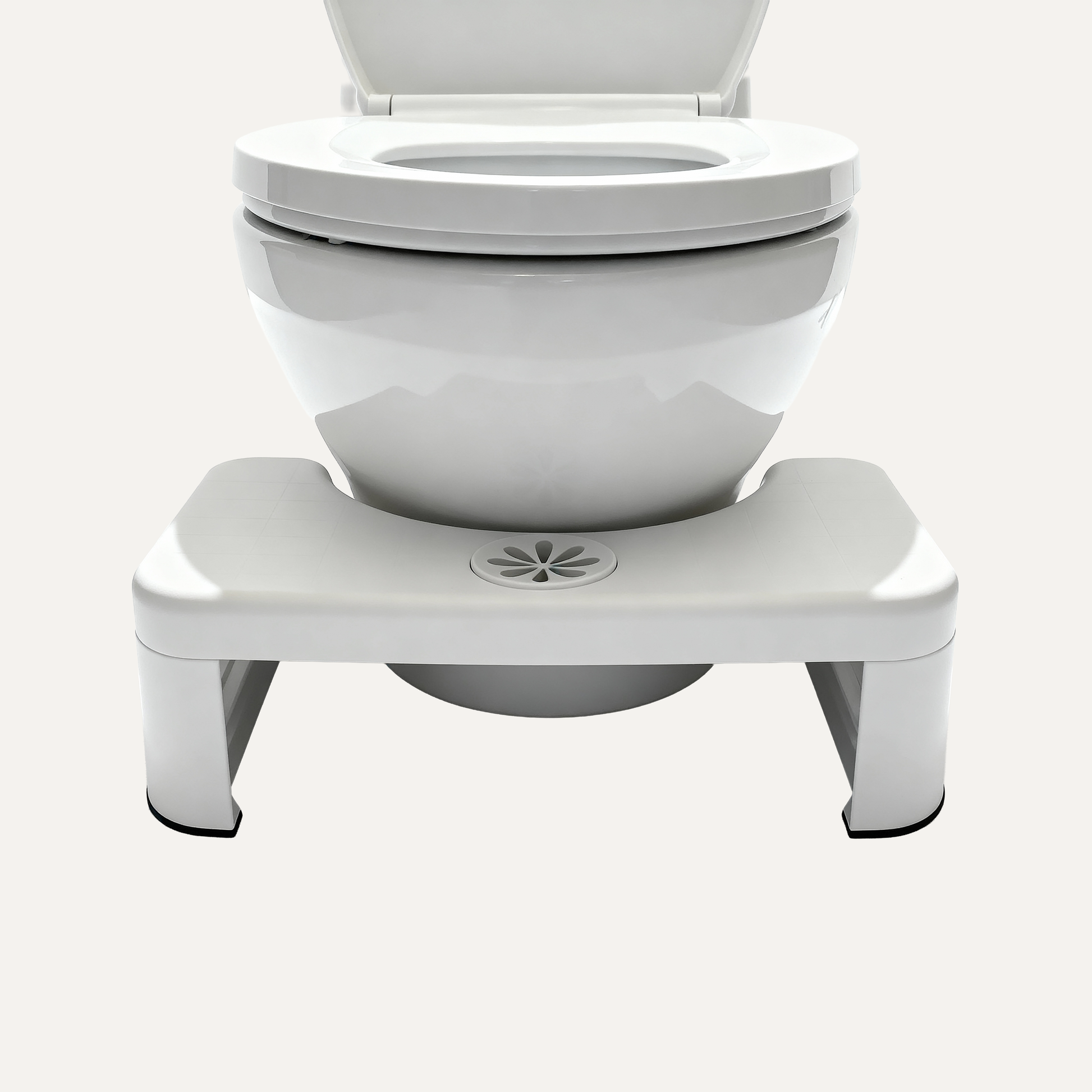 White toilet with a white footstool right beneath it on a white background
