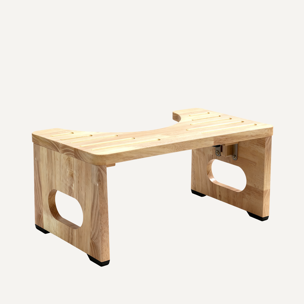 Wooden toilet footstool on a white background