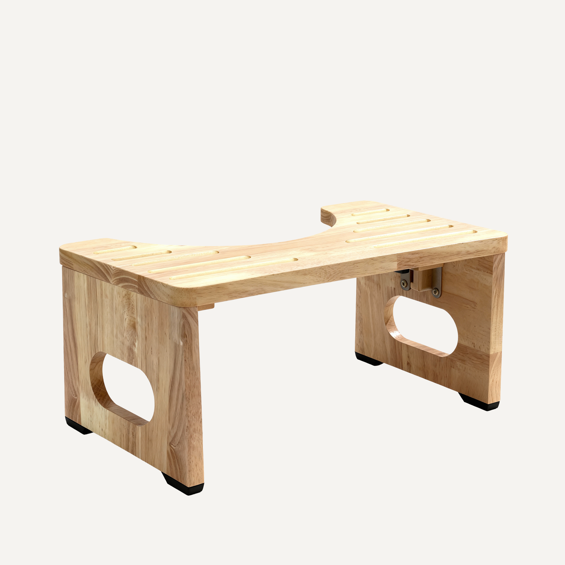 Wooden toilet footstool on a white background