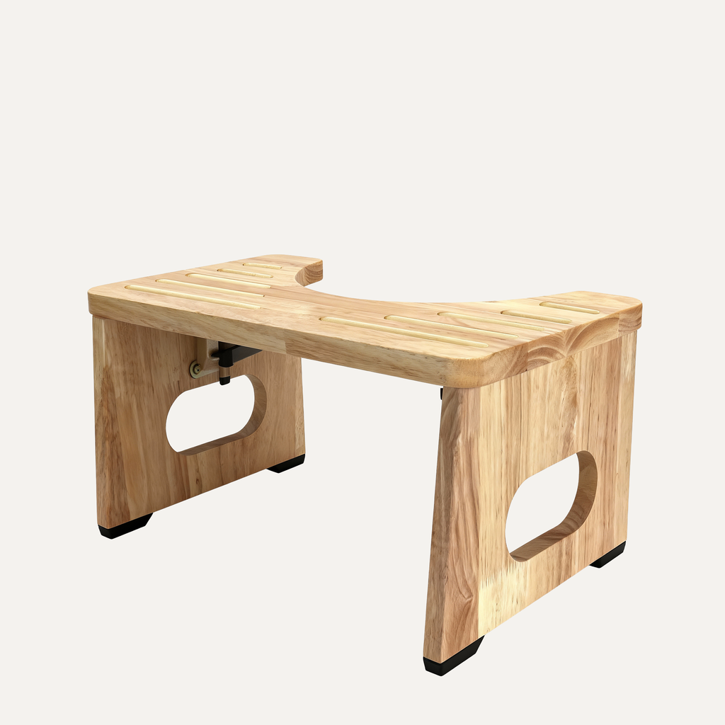 Wooden toilet stool with cut-out curved design on a white background